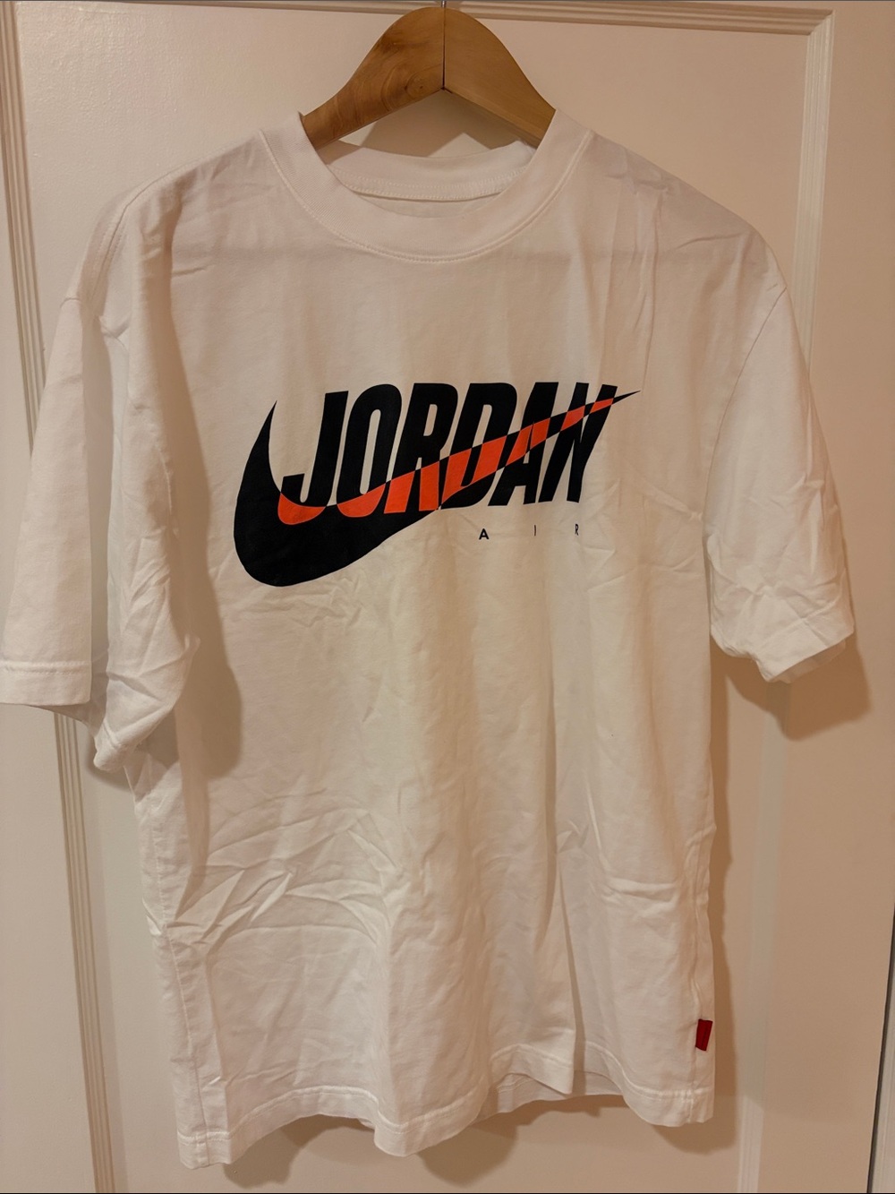 Jordan White Short Sleeve Tee with Black and Orange Logo